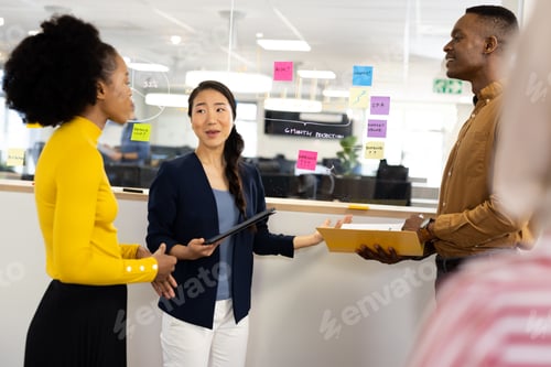 Preview: Diverse businesswomen talking and brainstorming in office