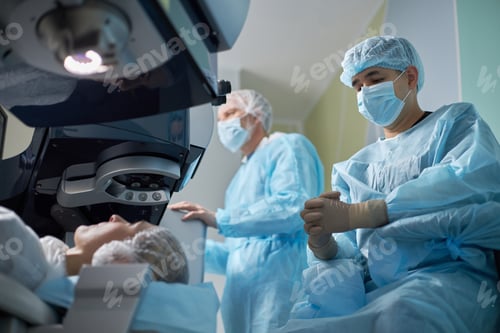 Preview: Surgeons Performing Procedure on Patient in Operating Room