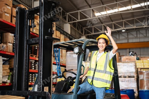 Preview: Warehouse worker with a forklift in the warehouse or storehouse., Industrial and industrial concept.