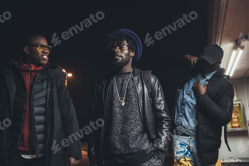 Preview: Three young african men walking in the street together