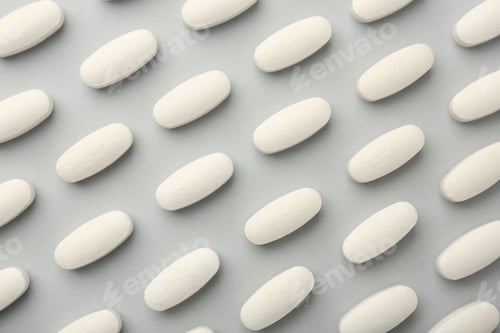 Preview: Vitamin pills on light grey background, flat lay. Health supplement