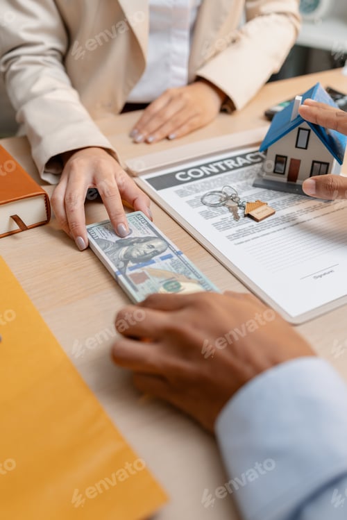 Preview: A real estate agent presents a property sale contract to a client