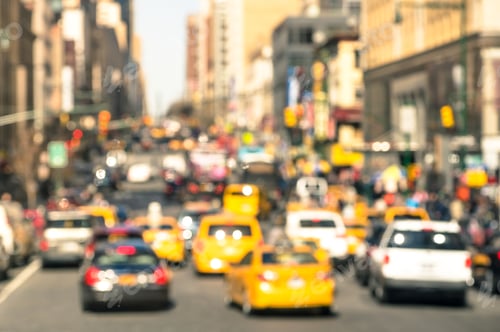 Preview: Rush hour with defocused cars and yellow taxi cabs