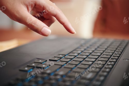 Preview: Typing on Black Keyboard with Blue Backlighting