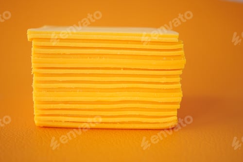 Preview: Slicing cheese into pieces closeup,