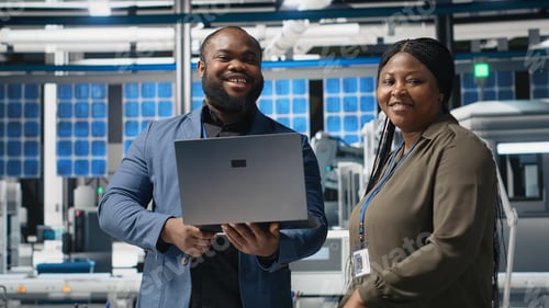 Preview: Black factory inspectors engaging in a briefing over the manufacturing process