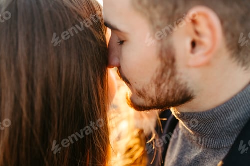 Preview: Young and beautiful couple walking outdoors on a sunny day