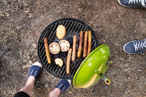 Preview: Barbecue grill with sausages, cheese and vegetables.
