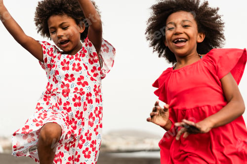 Preview: African american twin sisters running on the beach together