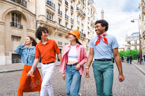 Preview: Group of young happy friends visiting Paris and Eiffel Tower