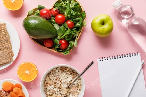 Preview: top view of fresh diet food, blank notebook with pencil and water on pink background