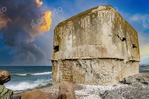 Preview: The bunker stands on the beach near the Black Sea with a war on the background of a cloudy sky