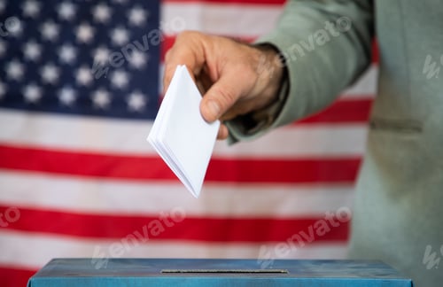 Preview: usa elections the hand of voter putting her vote in the ballot box