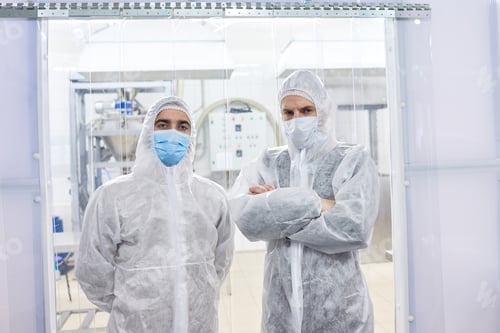 Preview: Two factory workers standing in protective clothes