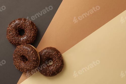Preview: Tasty chocolate donuts on three tone background