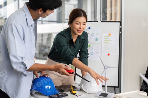 Preview: Sustainability in Action. Engineers Collaborating on Renewable Energy Project.