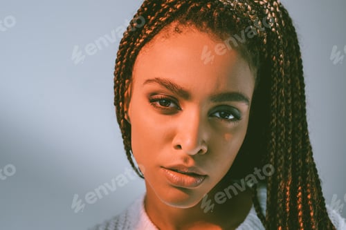 Preview: close-up portrait of beautiful young african american woman looking at camera
