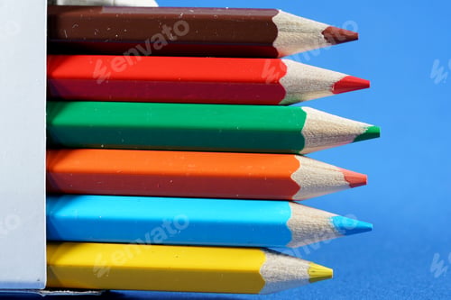 Preview: Set of colorful pencils on blue background