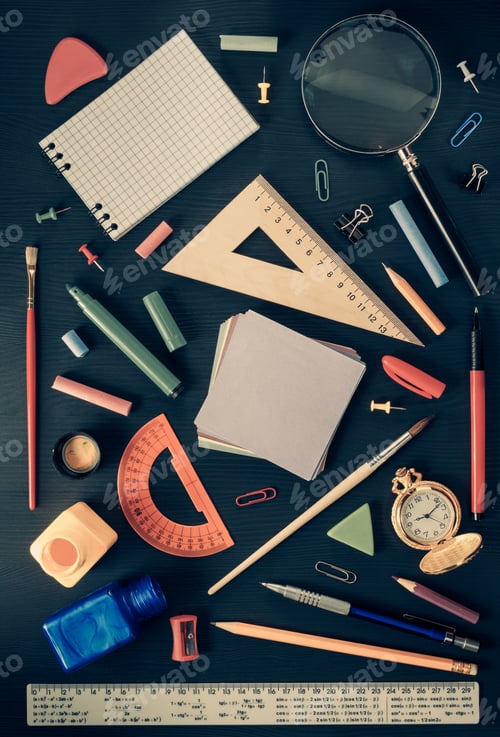 Preview: school supplies on black wood