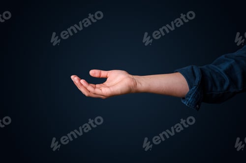 Preview: Male hand on the dark blue background