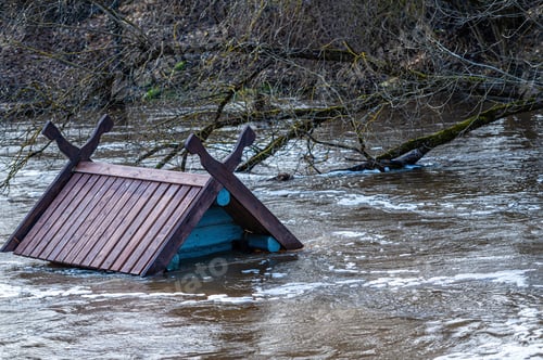 Preview: to the roof flooded in spring floods bird house - feeder in the river near the pedestrian bridge