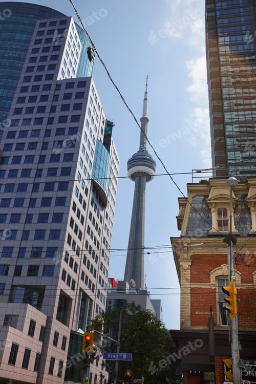 Preview: Low angle view of CN Tower between skyscrapers, Toronto, Canada