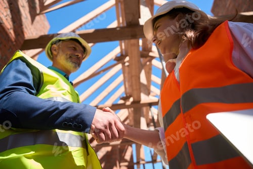 Preview: General forewoman shaking hand to contractor, making deal for roof covering