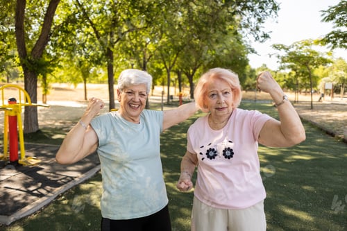 Preview: Senior women showing strong arms and vitality in park