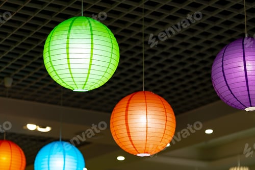 Preview: Vibrant Paper Lanterns Hanging From the Ceiling in a Festive Indoor Setting