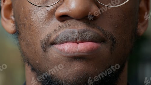 Preview: Macro shot of african american person moving his lips