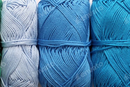 Preview: Tightly Wound Blue Yarn Bundles Close Up