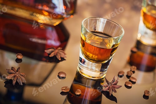 Preview: Cognac or Liqueur, Coffee Beans and Spices on a Glass Table