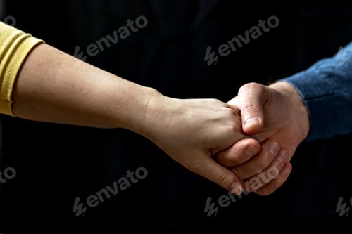 Preview: Young couple holding hands showing love and care, husband and wife are tenderly close together