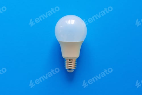 Preview: One light bulb on a blue paper background