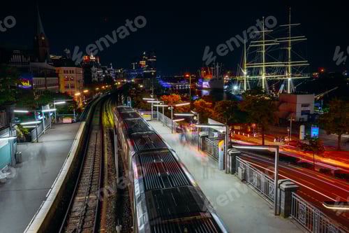 Preview: Landungsbruecken in Hamburg during night. Panorama of Harbor and metro station, Germany. Light