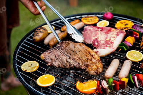 Preview: Closeup of barbecues steaks on the charcoals grill