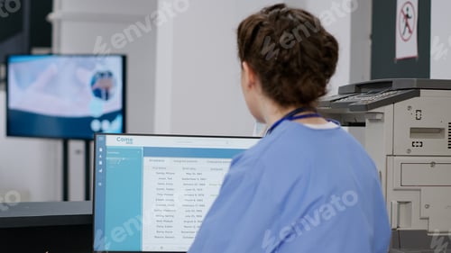 Preview: Medical nurse checking exam appointments on computer