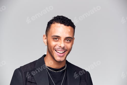 Preview: Studio Portrait Of Young Man With Skin Pigmentation Disorder Smiling At Camera