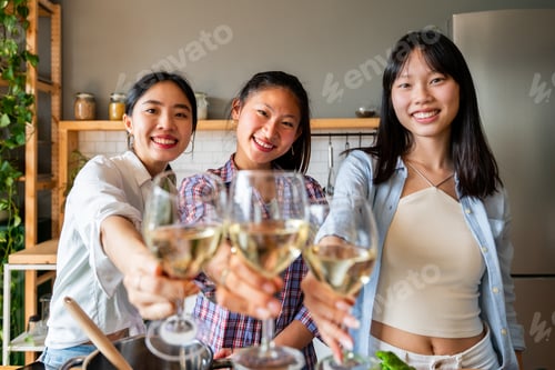 Preview: Happy beautiful chinese women friends bonding at home