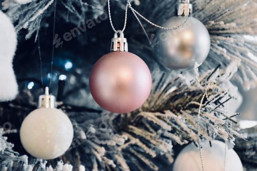 Preview: Three baubles hanging on a Christmas tree