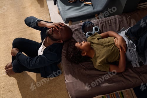 Preview: Top View Black Family Lying on Bed