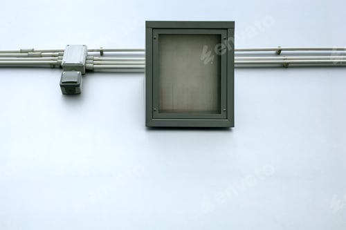 Preview: One square LED industrial street flood light with wires and switch, on street wall background.