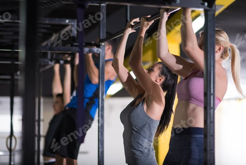 Preview: young athletes doing pull ups on the horizontal bar