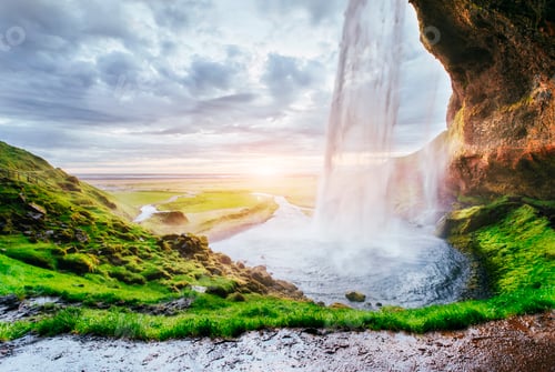 Preview: Seljalandfoss waterfall at sunset. Bridge over the river. Fantastic nature. Iceland