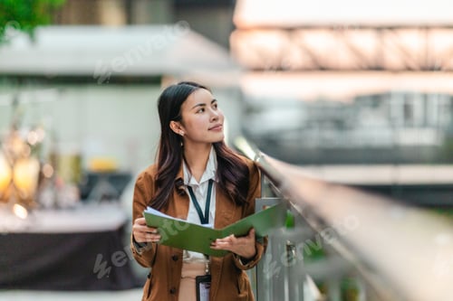Preview: Female Architect Reviewing Plans for Eco-Friendly Building