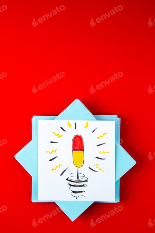 Preview: top view blue paper stickers with pills drawing on red background vaccine covid- color pill