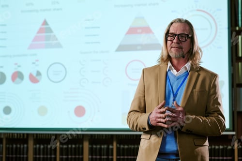 Preview: Middle Aged Caucasian Man Giving Business Presentation with Infographics