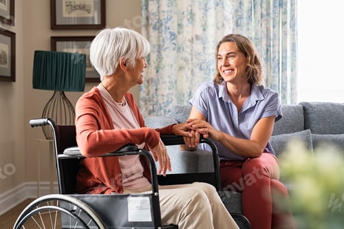 Preview: Happy adult woman visiting her elderly mother at home