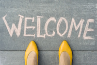 Preview: Eye-Level View of 'Welcome' on the Ground