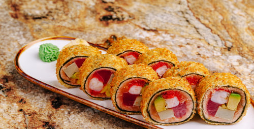 Preview: Crunchy sushi rolls served on a plate with wasabi